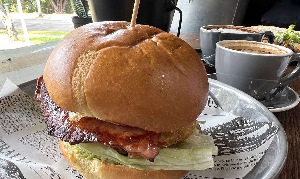 Provided screenshot of a breakfast burger and coffee.